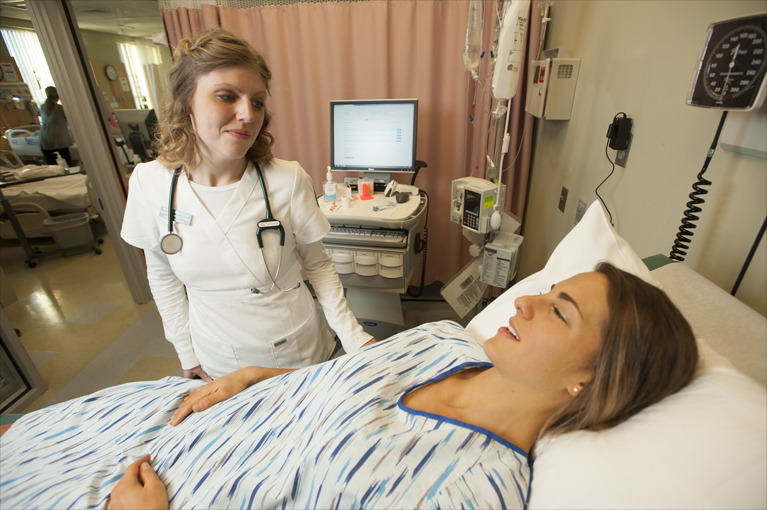 Nursing student working in the simulation lab