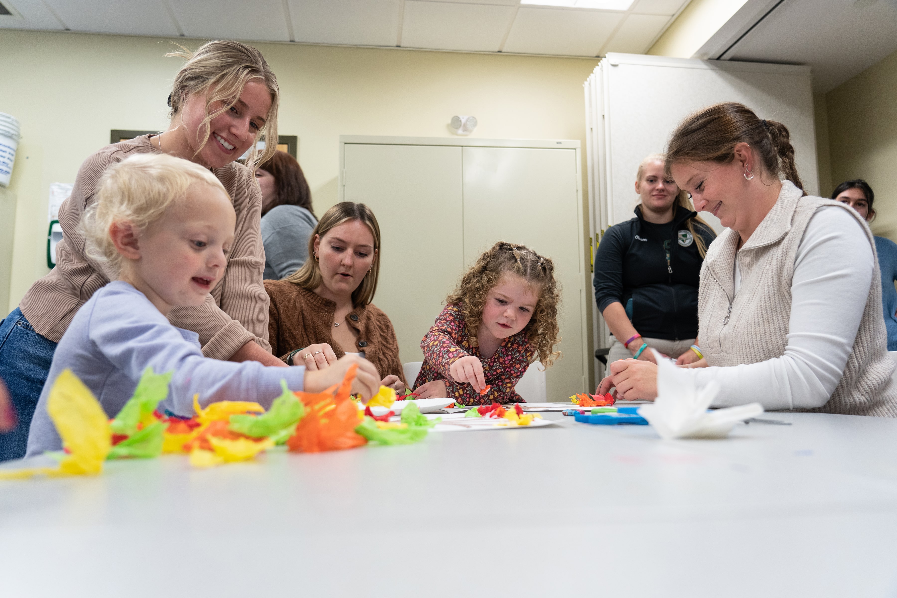 Occupational therapy students working on activities with young patients.