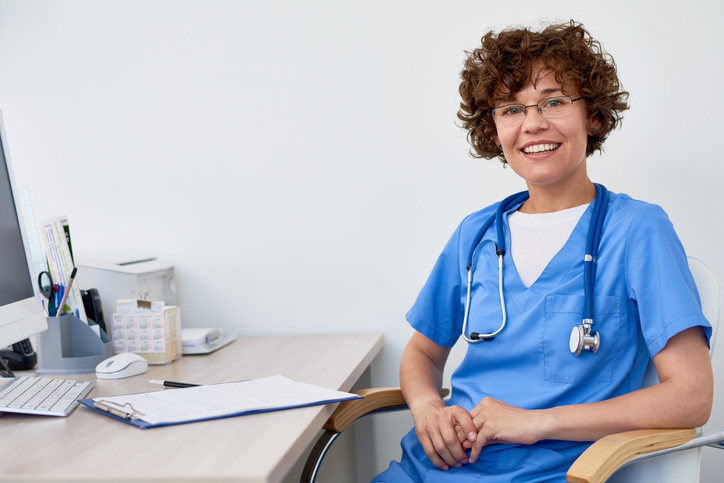 nursing sitting at a desk