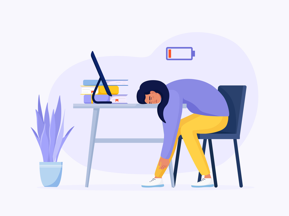 Animated image of an exhausted female student with her head down on her desk with a low battery signal above her head.